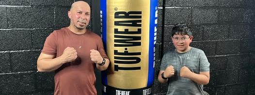 Father and son after a boxing session at MPL Box Fit in Haslingden