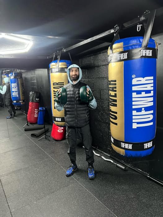 Coach Umair on the MPL Box Fit training floor during the first week of personal training
