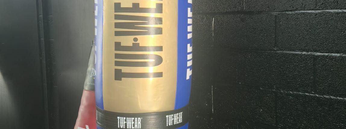 A blue and gold TUF-WEAR heavy bag at MPL Box Fit